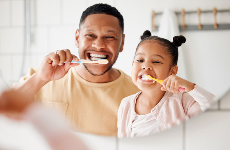 Dentist with a child patient, representing stomatology expertise