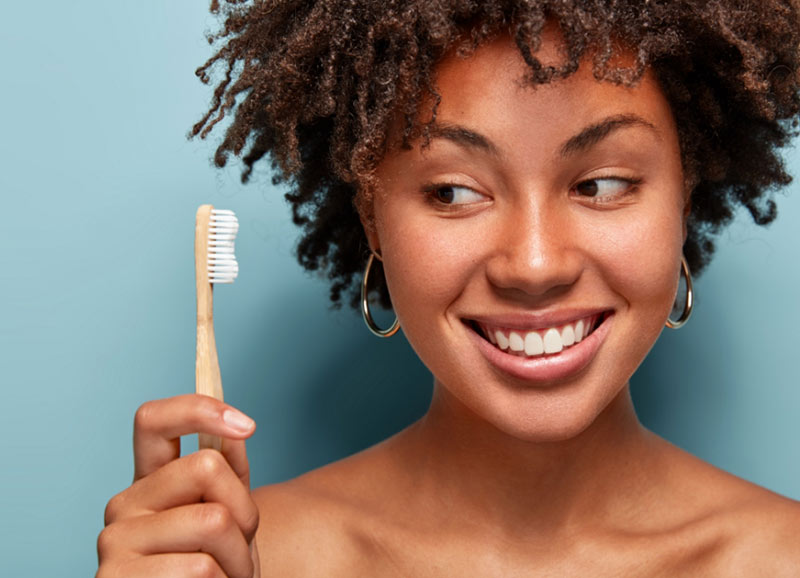 Dentist performing cosmetic dental procedure