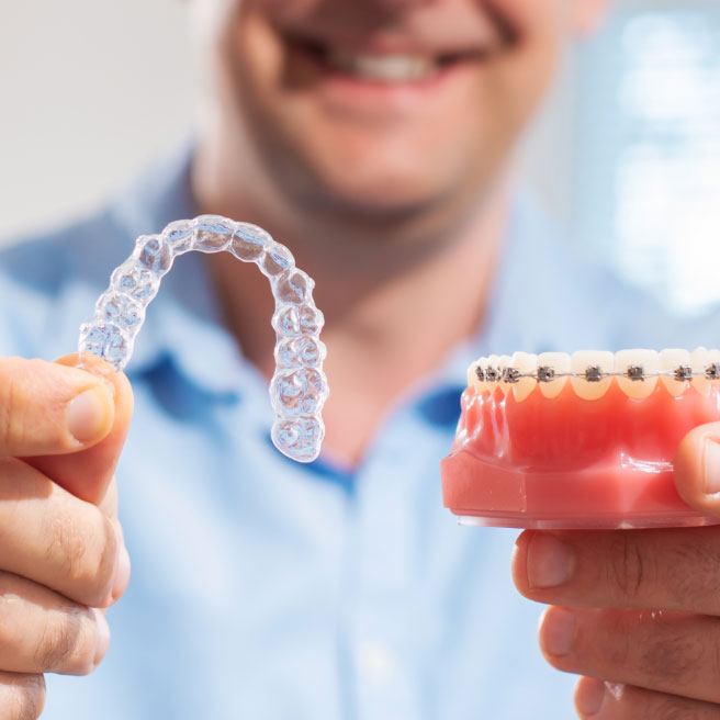 Dentist performing cosmetic dental procedure