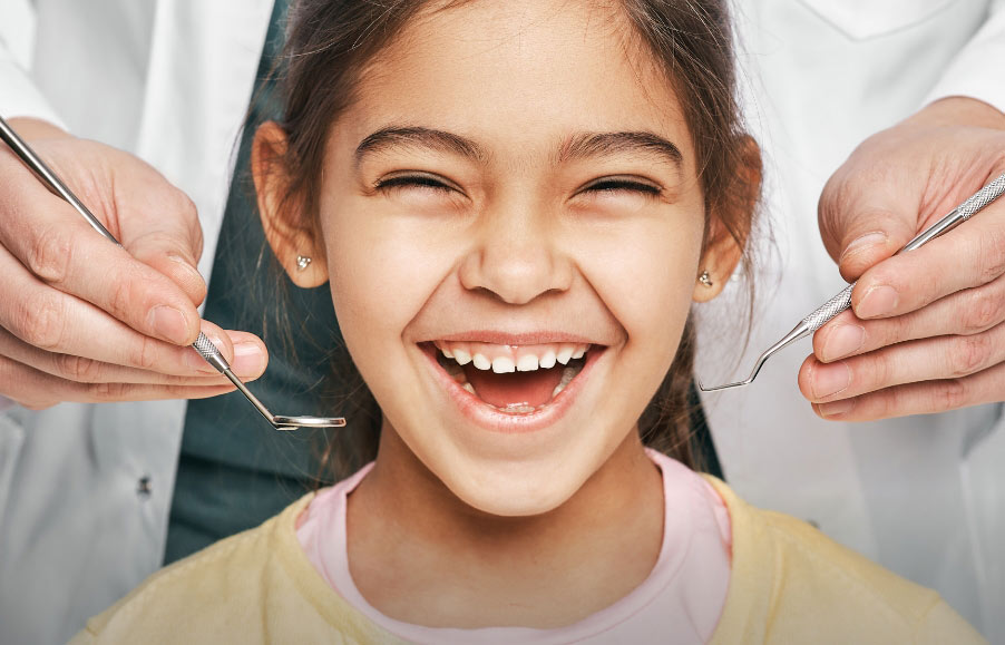 Smiling child receiving dental care at CentreForTeeth